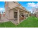Inviting backyard featuring a covered patio and lush green lawn, perfect for outdoor relaxation at 943 Sedona Rd, Henderson, NV 89014