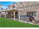 Relaxing backyard featuring a covered patio, hot tub, and comfortable seating for outdoor enjoyment at 943 Sedona Rd, Henderson, NV 89014