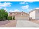 Charming home with a two-car garage, neutral paint, and well-manicured shrubs at 943 Sedona Rd, Henderson, NV 89014