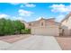 Charming home with a two-car garage, neutral paint, and well-manicured shrubs at 943 Sedona Rd, Henderson, NV 89014