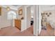Hallway featuring wall decor and entry into other bedrooms with lots of light at 943 Sedona Rd, Henderson, NV 89014