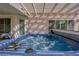 Close-up of a sparkling blue hot tub on a patio, promising relaxation and entertainment in the backyard at 943 Sedona Rd, Henderson, NV 89014