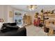 Living area features a ceiling fan, tile flooring and sliding door access to the backyard at 943 Sedona Rd, Henderson, NV 89014