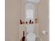 Small toilet area with white toilet and white window shutters at 943 Sedona Rd, Henderson, NV 89014