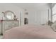 Bright bedroom featuring carpet, dresser, and a decorative mirror and headboard at 964 Norwood Heights Ln, Las Vegas, NV 89138