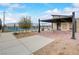 A shaded seating area, tables, and nearby pickleball courts are part of the community's amenities at 964 Norwood Heights Ln, Las Vegas, NV 89138