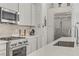 Kitchen featuring stainless steel appliances, tile backsplash, and a spacious countertop at 964 Norwood Heights Ln, Las Vegas, NV 89138