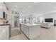 Open-concept kitchen with a large island and stainless steel appliances, connected to the living area at 964 Norwood Heights Ln, Las Vegas, NV 89138