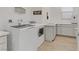 Bright laundry room with modern washer and dryer and countertops for folding at 964 Norwood Heights Ln, Las Vegas, NV 89138