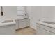 Neat laundry area with counter space, storage cabinets and a window at 964 Norwood Heights Ln, Las Vegas, NV 89138
