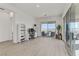 Bright living room with hardwood floors, a workstation and an outside patio at 964 Norwood Heights Ln, Las Vegas, NV 89138