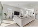 Living room with light and bright decor and walls of windows at 964 Norwood Heights Ln, Las Vegas, NV 89138