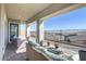 Inviting covered patio with comfortable seating and open views of the city at 964 Norwood Heights Ln, Las Vegas, NV 89138