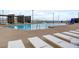 Community pool with lounge chairs and shade structures for relaxation at 964 Norwood Heights Ln, Las Vegas, NV 89138