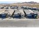 Street view showcases modern homes within a neatly landscaped community with mountain views at 964 Norwood Heights Ln, Las Vegas, NV 89138