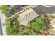 Overhead view of a home with a well-maintained roof, turf backyard, and a paved patio area at 10223 Aragon Crown Rd, Las Vegas, NV 89135