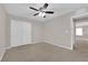 Bedroom features a ceiling fan and a double door closet at 10223 Aragon Crown Rd, Las Vegas, NV 89135