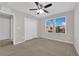Bedroom features a ceiling fan and bright, updated windows at 10223 Aragon Crown Rd, Las Vegas, NV 89135