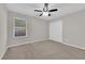 Bedroom features a ceiling fan and a large window at 10223 Aragon Crown Rd, Las Vegas, NV 89135