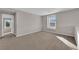 Spacious bonus room with plush carpeting and a large window providing natural light at 10223 Aragon Crown Rd, Las Vegas, NV 89135