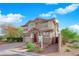 Charming two-story home with stone accents, a well-manicured lawn, and a brick driveway at 10223 Aragon Crown Rd, Las Vegas, NV 89135