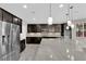 Modern kitchen boasts stainless appliances, granite counters, and ample cabinet space at 10223 Aragon Crown Rd, Las Vegas, NV 89135