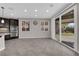 Bright open-concept kitchen space with sliding glass door to backyard at 10223 Aragon Crown Rd, Las Vegas, NV 89135