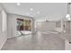 Spacious living room features recessed lighting, neutral paint, and backyard access at 10223 Aragon Crown Rd, Las Vegas, NV 89135