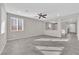 Bright living room with neutral paint, recessed lighting, ceiling fan, and modern tile flooring at 10223 Aragon Crown Rd, Las Vegas, NV 89135