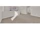 Spacious loft with neutral carpet, paint, and bright natural light at 10223 Aragon Crown Rd, Las Vegas, NV 89135