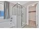 Bathroom featuring a glass shower, soaking tub and closet at 10574 Siesta Key St, Las Vegas, NV 89141