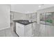 Kitchen island featuring stone countertops, stainless steel appliances, and sliding door to the yard at 10574 Siesta Key St, Las Vegas, NV 89141