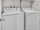 Clean laundry area with white, front-loading washer and dryer units at 10574 Siesta Key St, Las Vegas, NV 89141