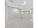 Upstairs loft area with neutral carpeting and white banister at 10574 Siesta Key St, Las Vegas, NV 89141
