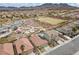 Scenic aerial shot of a community, featuring a playground, pool, and well-maintained landscaping at 1140 Highbury Grove St, Henderson, NV 89002