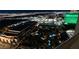 Expansive aerial night view featuring hotels, pools, and lush landscaping at 125 E Harmon Ave # 3406 & 3408, Las Vegas, NV 89109