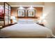 Modern bedroom featuring a comfortable king bed, elegant lighting, and artwork at 125 E Harmon Ave # 3406 & 3408, Las Vegas, NV 89109
