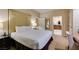 Spacious bedroom with a comfortable bed and a partial view into the ensuite bathroom at 125 E Harmon Ave # 3406 & 3408, Las Vegas, NV 89109