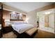 Bright bedroom showcasing a king bed, ensuite bathroom, and tasteful furnishings at 125 E Harmon Ave # 3406 & 3408, Las Vegas, NV 89109