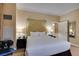 Well-lit bedroom with a king-size bed, bedside table, and a view of the doorway at 125 E Harmon Ave # 3406 & 3408, Las Vegas, NV 89109