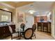 Comfortable dining space featuring a glass table and four chairs with access to the kitchen at 125 E Harmon Ave # 3406 & 3408, Las Vegas, NV 89109