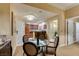 Dining area featuring a glass table, seating for four, and kitchen access at 125 E Harmon Ave # 3406 & 3408, Las Vegas, NV 89109
