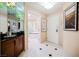 Elegant entryway features tile flooring, granite counters, and access to the bathroom at 125 E Harmon Ave # 3406 & 3408, Las Vegas, NV 89109