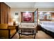 Relaxing sitting area with a plush sofa, table, and connecting bedroom space at 125 E Harmon Ave # 3406 & 3408, Las Vegas, NV 89109