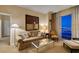 Chic living room with a comfortable sofa, stylish furnishings, and breathtaking city vistas at 125 E Harmon Ave # 3406 & 3408, Las Vegas, NV 89109