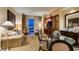 Tastefully decorated living room featuring comfortable seating, a wet bar, and a cityscape backdrop at 125 E Harmon Ave # 3406 & 3408, Las Vegas, NV 89109