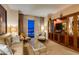 Serene living room featuring a TV, comfortable seating, and captivating city views at 125 E Harmon Ave # 3406 & 3408, Las Vegas, NV 89109
