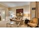 Comfortable living room featuring a plush sofa, armchair, and a glass-top coffee table at 125 E Harmon Ave # 3406 & 3408, Las Vegas, NV 89109
