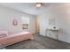 Cozy bedroom with neutral carpet, white walls, one window and simple furnishings at 1364 Cerulean Ave, Henderson, NV 89002