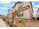Stunning two-story home featuring a neutral-colored exterior, manicured landscaping, and mountain views at 1364 Cerulean Ave, Henderson, NV 89002